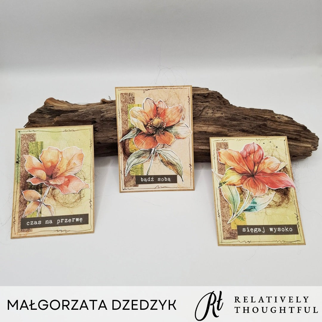 Three floral cards displayed around a wooden log made by Margorzata Dzedzyk for Relatively Thoughtful. The Poppy Fields collection