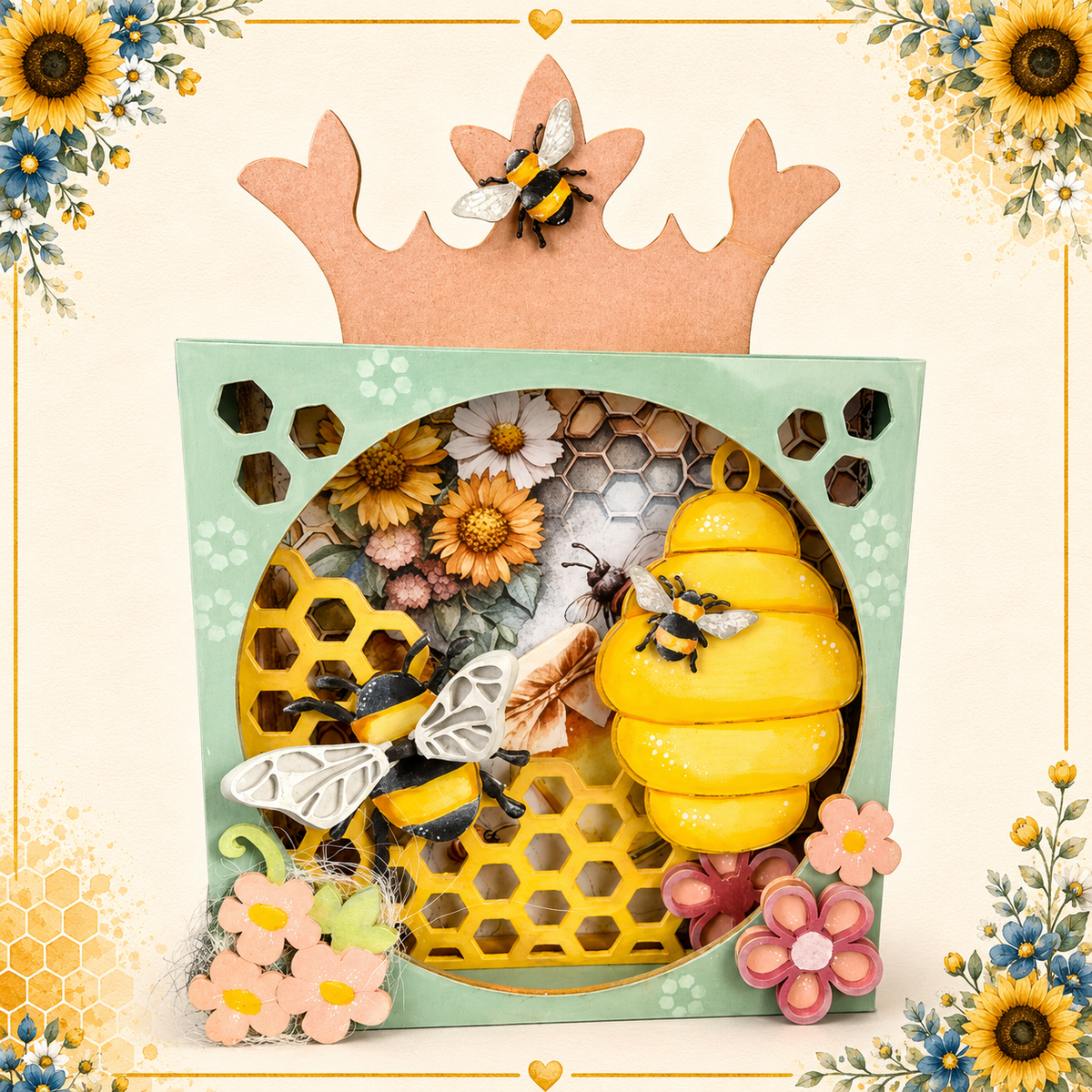 A decorative honey-themed gift box with a mint green frame, a large yellow beehive piece, honeycomb details, flowers, bees, and a peach crown topper, shown on a cream background with floral corner decorations.